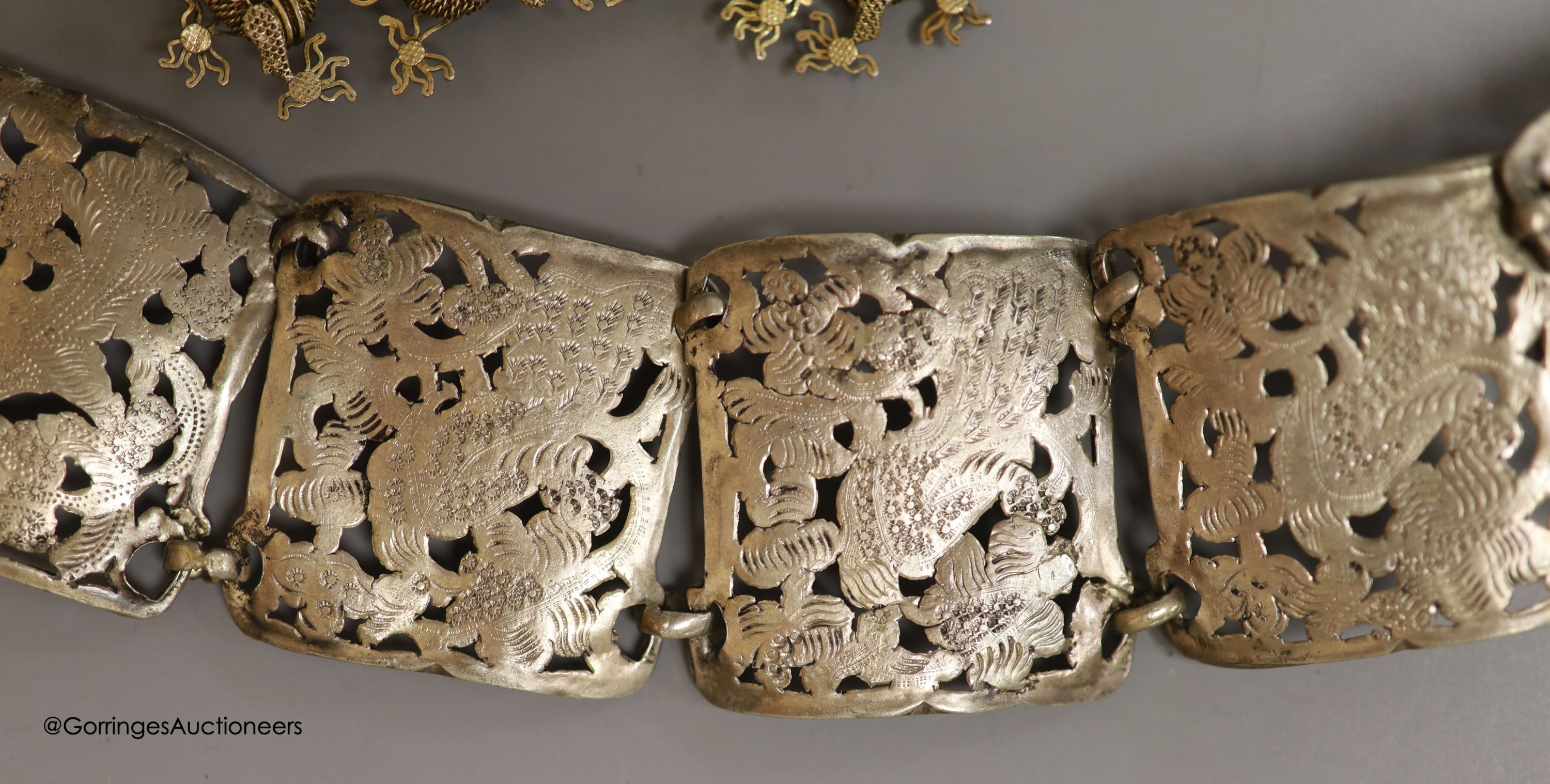 A white metal Chatelaine, together with a Chinese brooch etc.